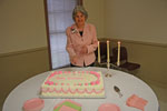 Beverly Watts, a 48 year member of Metairie Woman's Club, cuts the birthday cake on Founders Day celebrating the club's 73rd birthday.