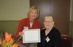 Immediate past-president, Coleen Landry, presents a certificate to Ann Riser acknowledging her 25 years as a member of Metairie Woman's Club. 2010 Immediate past-president, Coleen Landry, presents a certificate to Ann Riser acknowledging her 25 years as a member of Metairie Woman's Club. 2010