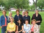 2009-Dedication ceremony of the Park Bench in Lafreniere Park donated by MWC in memory of Sheriff Harry Lee. Seated: Coleen Landry, bench chairman; Cindy Lee Sheng, Mrs. Harry Lee, and Elsie Manos. Standing: Jerri Klein, Iona Myers, Jennie Bryant, Linda Deichmann, Joan Demarest and Carol Beckleheim.