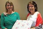 Historian Yvonne Perret presents scrapbook to 2014-15 President Judy Wood Historian Yvonne Perret presents scrapbook to 2014-15 President Judy Wood